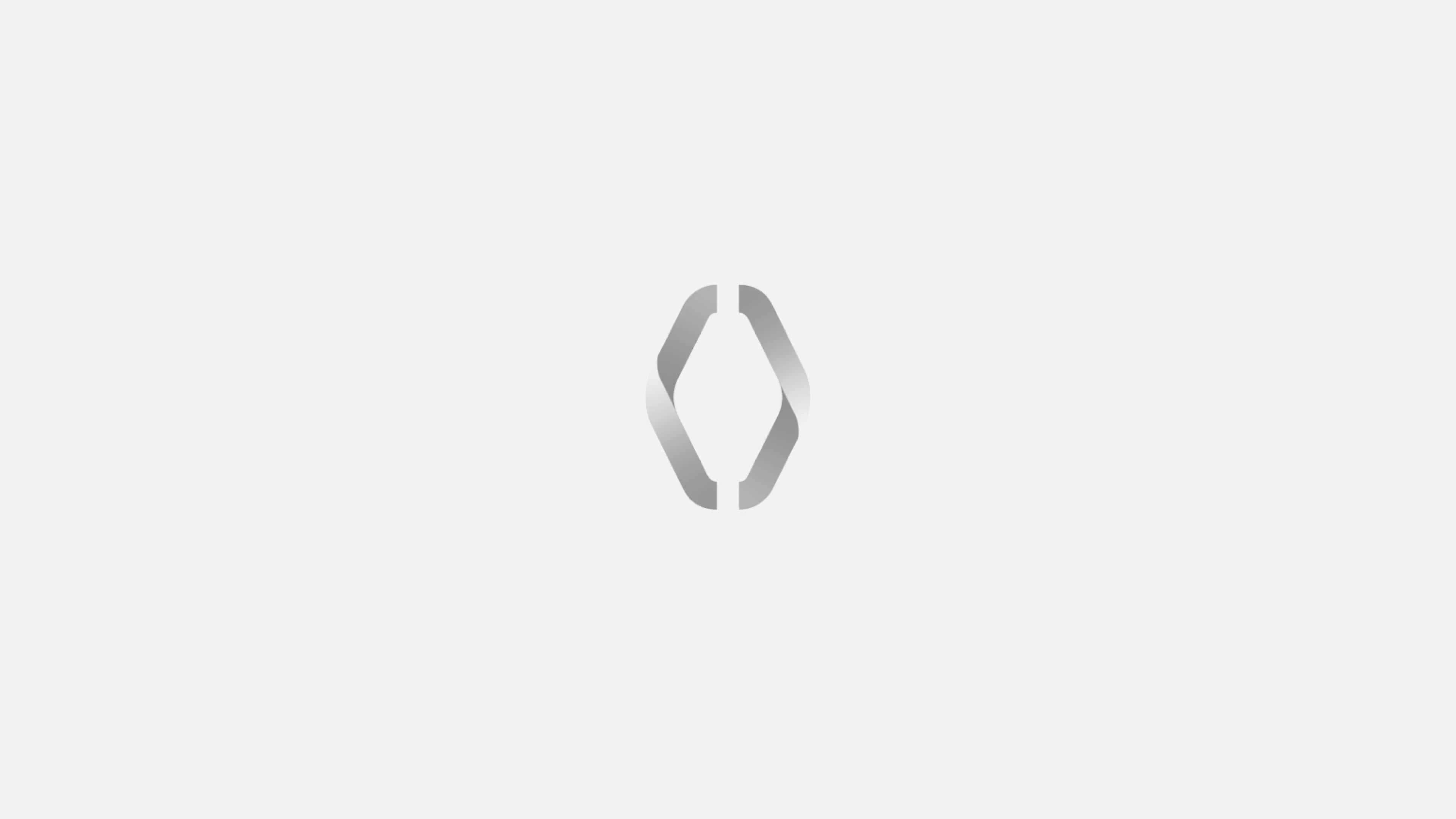 A stylized, abstract logo resembling a diamond shape with two symmetrical, curved lines on each side.